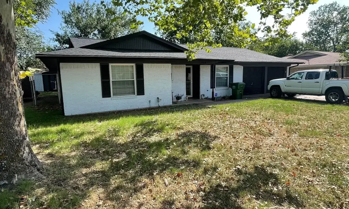 Professional roofing crew working on a residential roof in Morehead